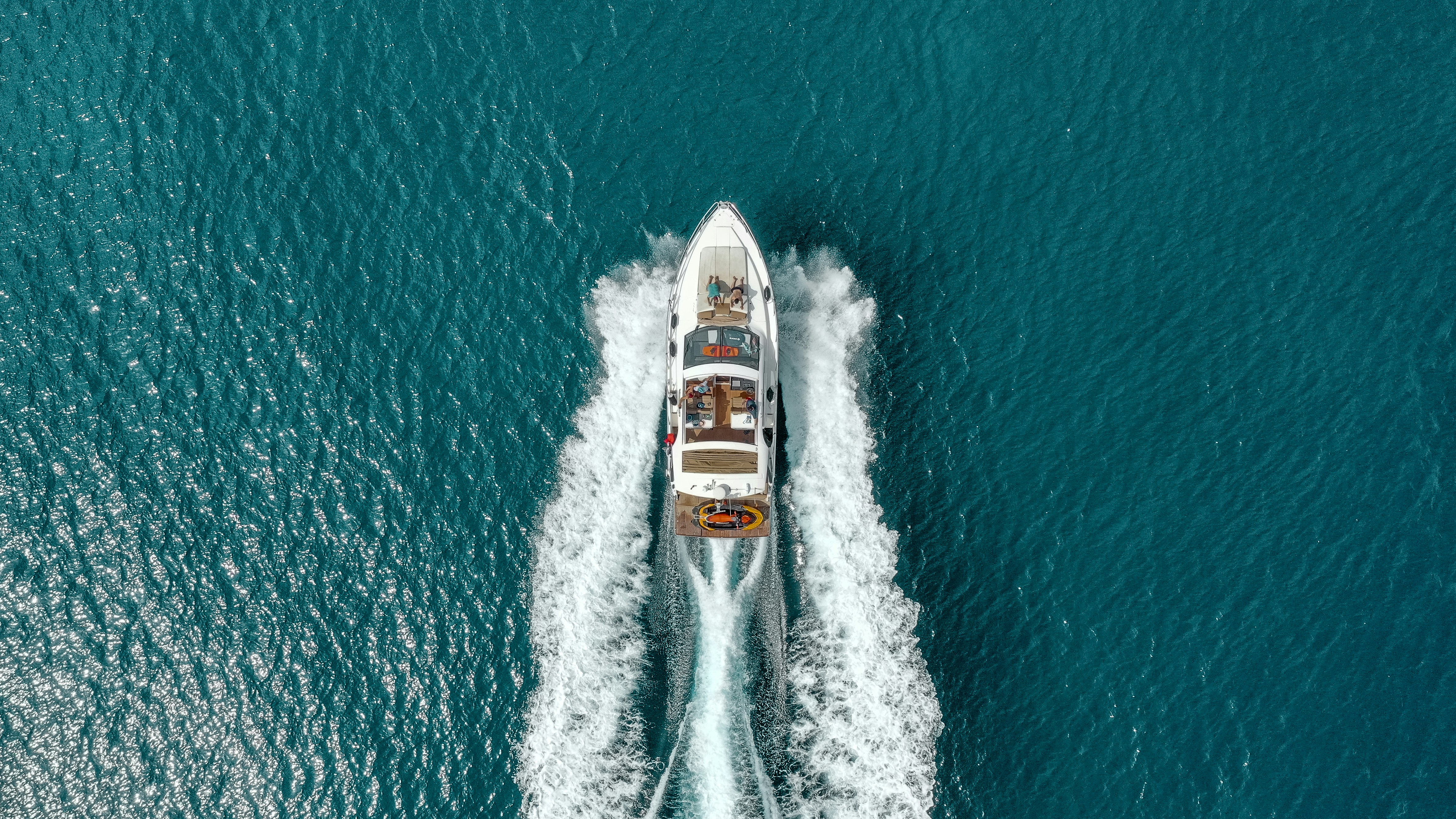 Bow-on view of a superyacht underway at sea